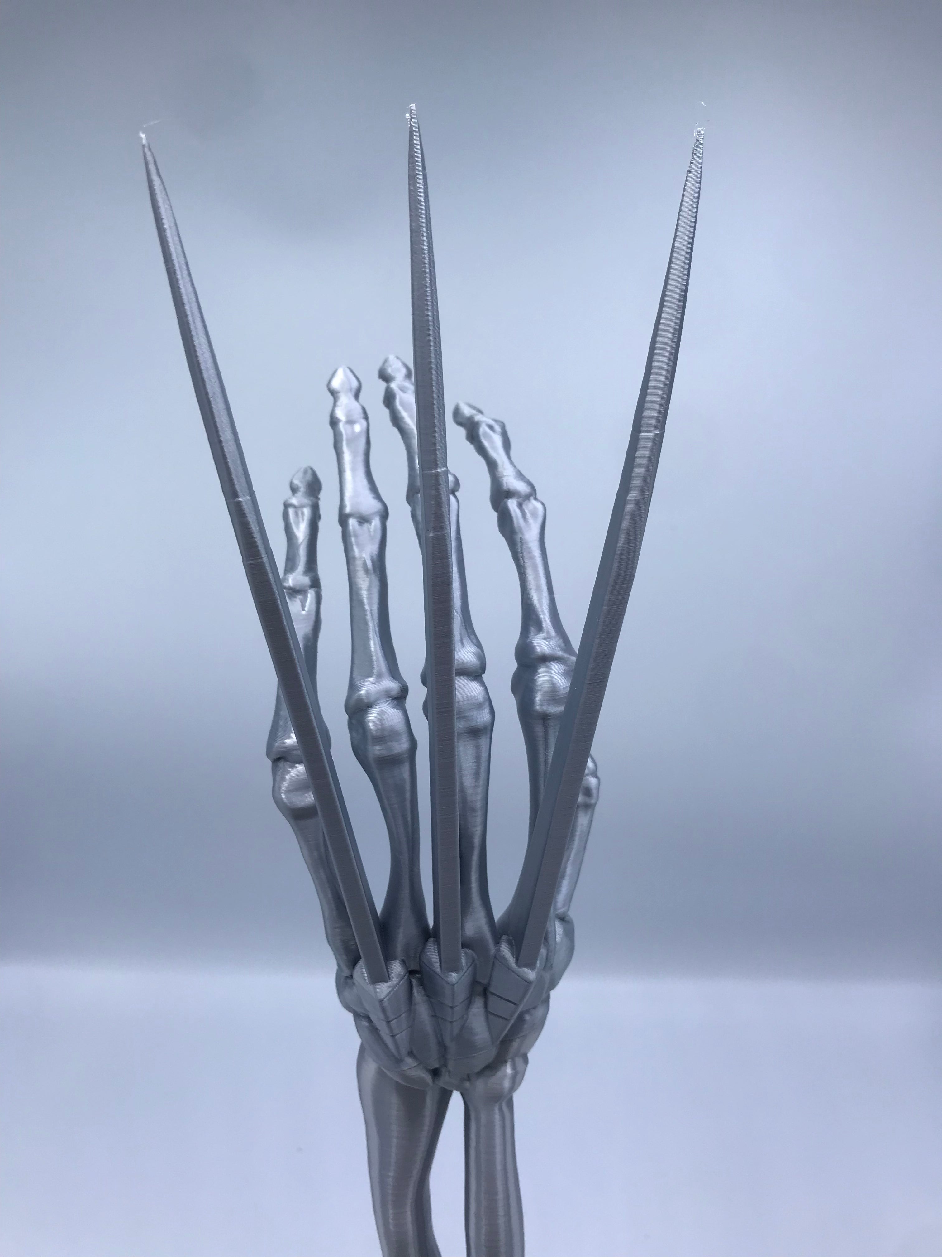 Wolverine Arm Statue