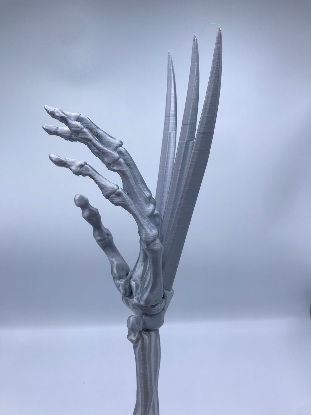 Wolverine Arm Statue